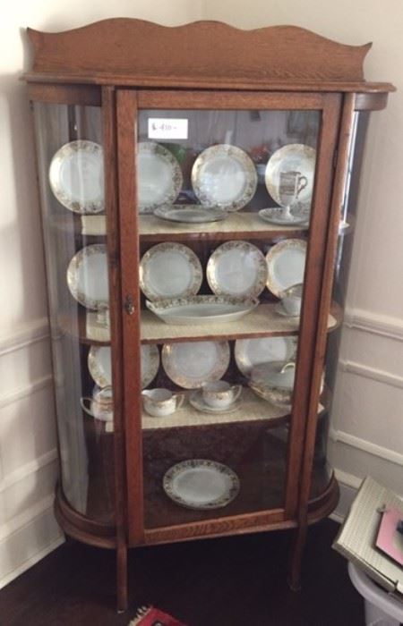 oak china cabinet it holds lots of fine china ( china not for sale ) 