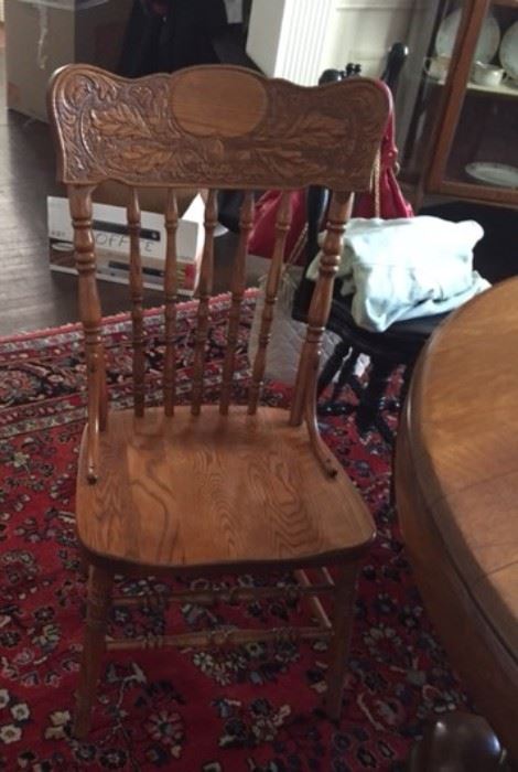 pair pressed back oak chairs