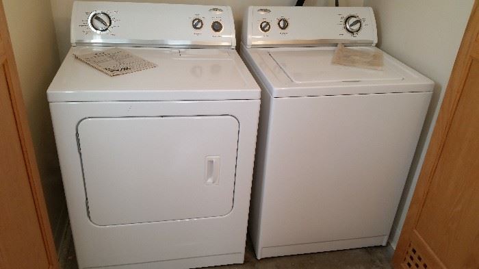 Newer Whirlpool washer and 220 electric dryer.