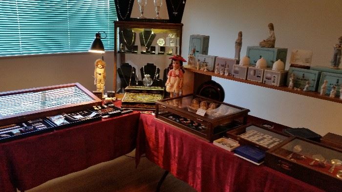 Lots of jewelry, Lladro's.  Antique dolls.  Vintage coins and more.