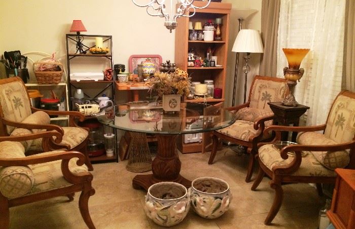 Wooden glass-topped table with 4 upholstered arm chairs, shelves, small kitchen appliances, lamps, & more