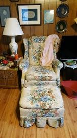 Wing back chair with ottoman, end table, table lamp, pineapple plate collection, and more. 