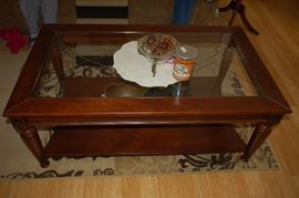 Glass top wood coffee table