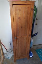 Tall wood storage cabinet
