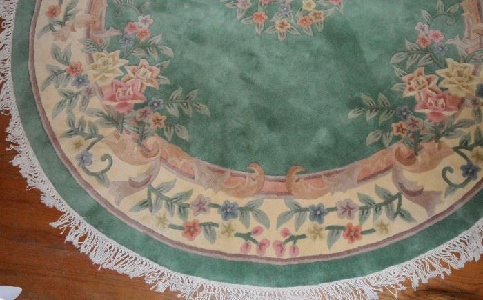 100% Wool oval rug with fringe and carved design.  Measures 8' x 10'.   Royal Palace "Floral Bouquet."  Very nice condition.