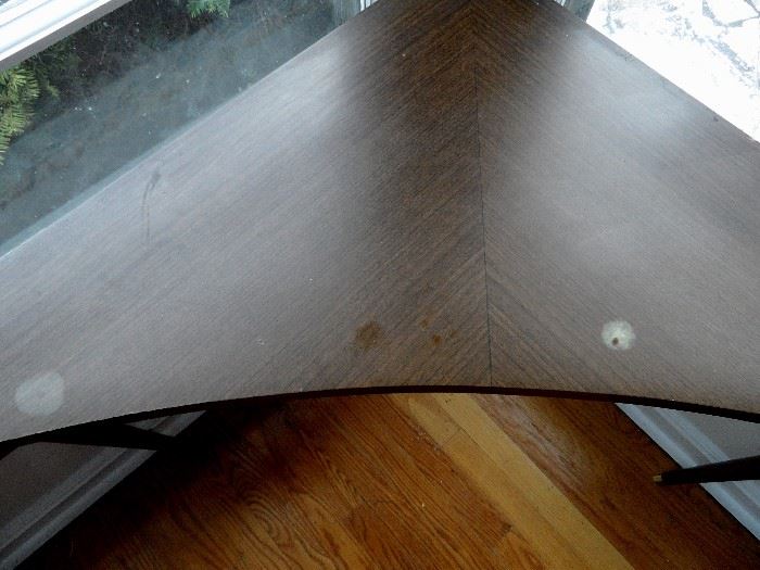 Mid Century corner table, pencil legs, laminate top.  27" tall, 32-1.2" x 46" wide.  Damage to top.