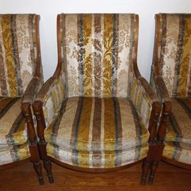 Four upholstered high-back arm chairs with solid wood frames.  Custom made by Loeblein Creations.