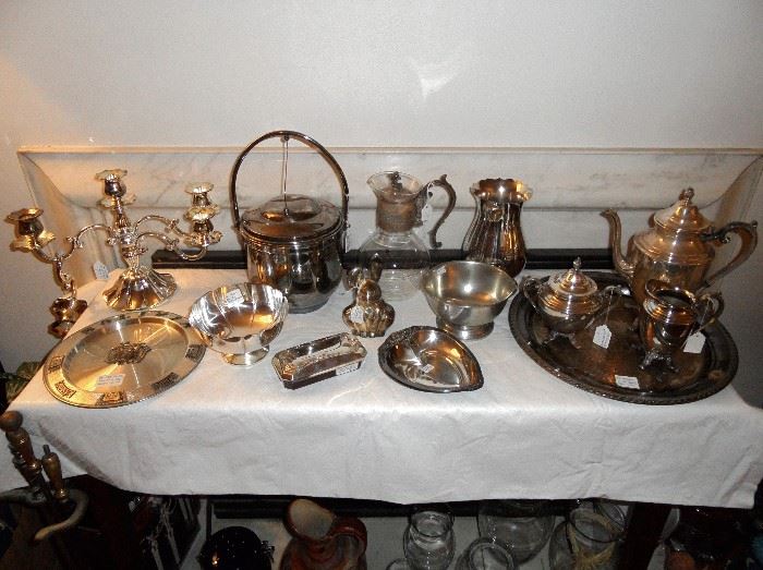 Silver plated serving pieces, trays, ice bucket, vase, etc .