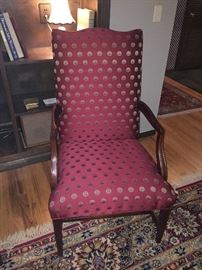 One of a pair of silk upholstered armchairs asking $
