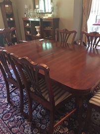 wonderful mahogany dining table and six chairs, pads included.  asking $680 . Table measures 62"l x 42"w x 29"h three leaves add 12" inch to the length.