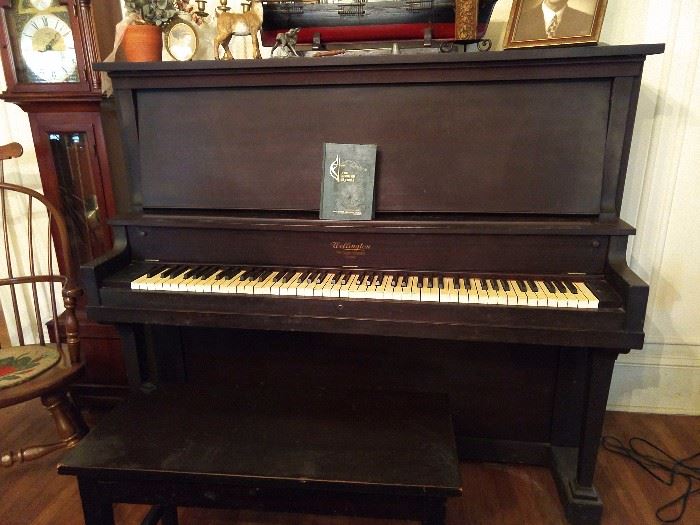 Vintage Wellington mahogany upright piano.        Includes the bench. We are so very generous!                 The serial number on this piano (244621) dates it at 95 years old, manufactured between 1923-1924. The soundboard states "The Cable Company, Chicago".