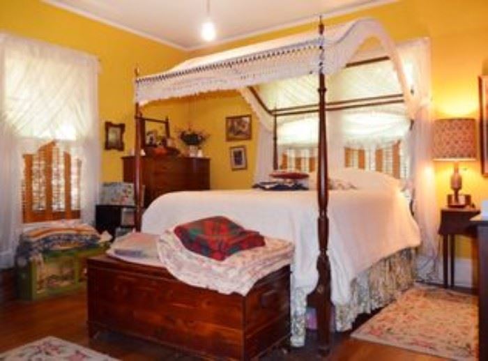 One of three vintage cedar chests in this house.  A very nice, vintage four poster mahogany bed, with hand-crocheted canopy.  The bed was made by Biggs Furniture Co., Richmond, VA.