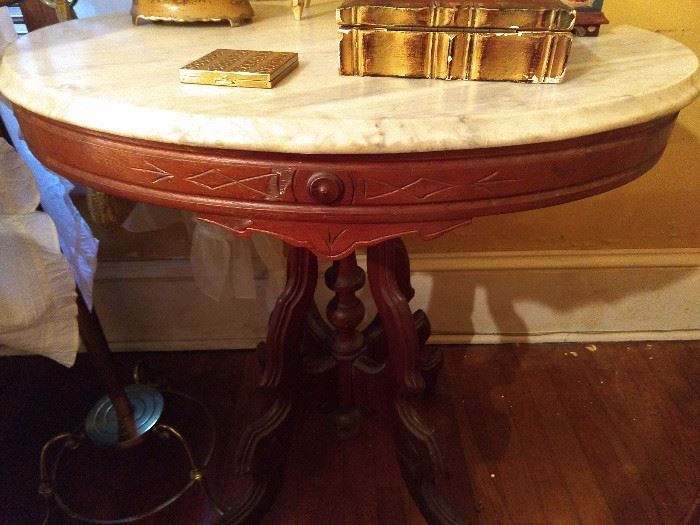 Hey look! Another Victorian, marble-topped oval side table.