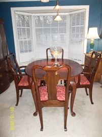 dining table with two leaves, pads, and four chairs (2 are Captain chairs)