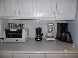 small kitchen appliances, coffee pots, blender, toaster oven