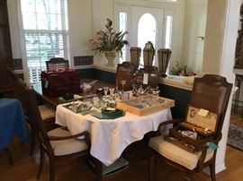 Large dining room table with leaves and pads with 6 chairs, jewelry, silver, Waterford