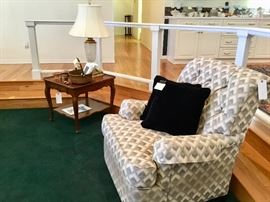 Side table, baskets, Native type items, overstuffed chair