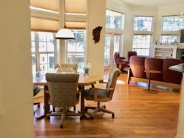 Kitchen table with rolling chairs, vintage cypress wall clock