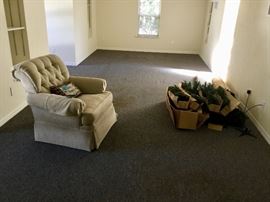 Upstairs— nice upholstered chair & a BIG put it together type Christmas tree