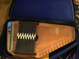 Sweet older autoharp with box, manual & music & picks.