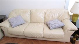 One of two matching leather sofas