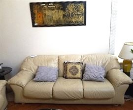 One of two matching leather sofas