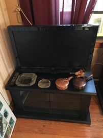 Flatscreen TV. Vintage ashtrays.