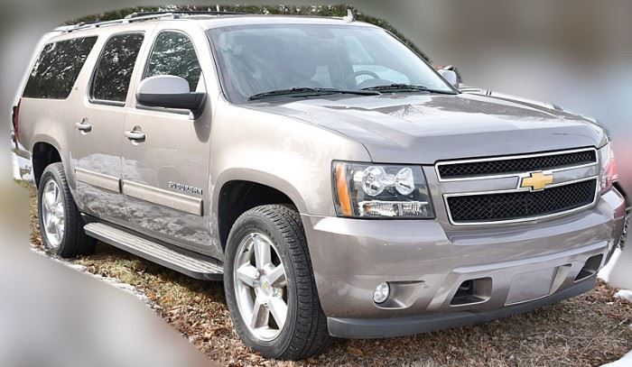 At 8PM: 2014 Chevy Suburban SUV Estate Auto with 19,359 Miles; 4 Wheel Drive with Traction Control; Silver Exterior with Black Leather Interior; Automatic Transmission; Power Everything; Heated Seats; 2-Position Driver Memory Seat; AM/FM Stereo with CD; Power Moonroof; Third Row Seating, and more. VIN: 1GNSKJE75ER230819
