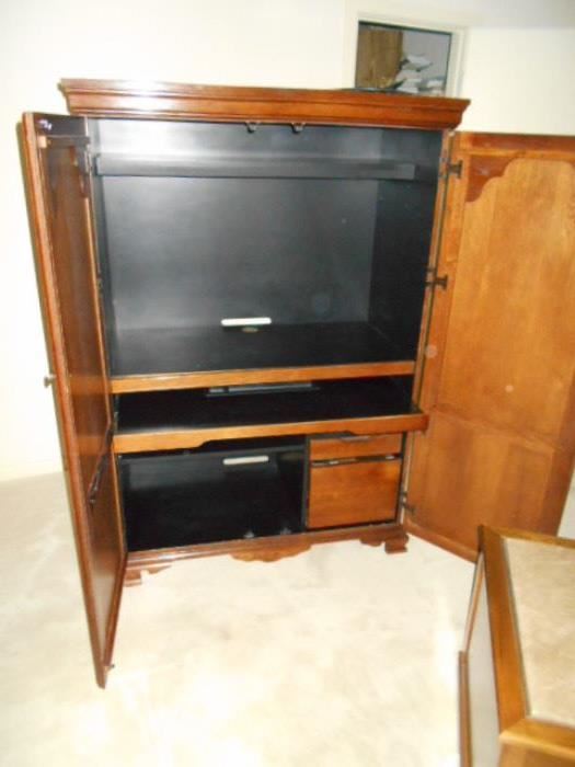 Riverside Furniture Corporation computer armoire.  Has a pull out keyboard shelf and a power station.