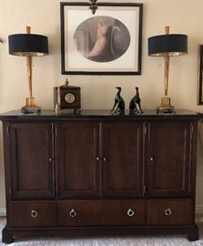 Stanley Dining Room: 60" Round Pedestal Table (perimeter extensions add 18" to overall width) w 6 Off-White Microfiber Chairs, Buffet w Black Granite Top, Sleek Table Lamps w Black and Brass Shades