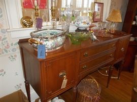 nice sideboard, hurricane lamps, baskets, Depression glass