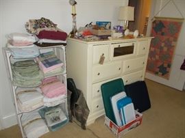 linens, crates, chest, lamps
