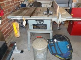 delta table saw, old cooler, bag of flotation devices