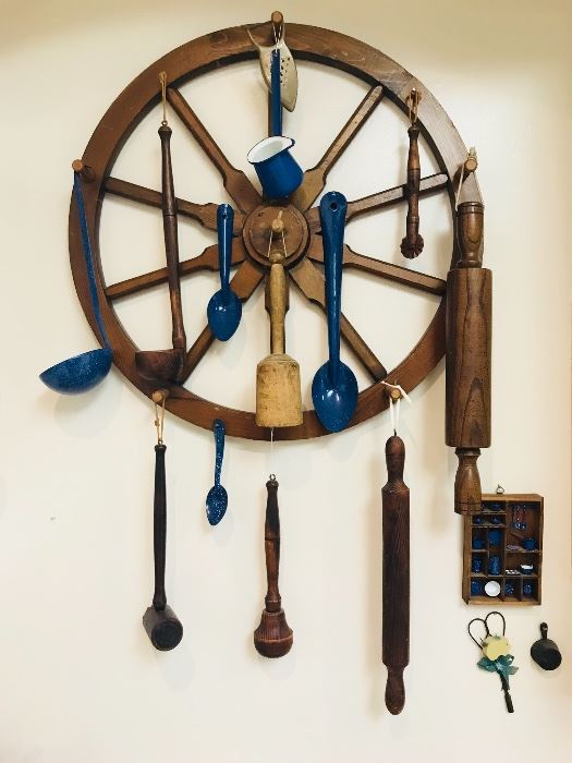 Vintage wagon wheel with kitchen utensils