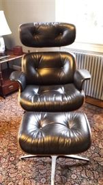 Brown leather Eames-style chair and ottoman