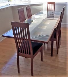 Callagaris (Italy) dining table with tempered glass.  Opens to 8' in length.   Collapses to 4'.   Great one owner condition 