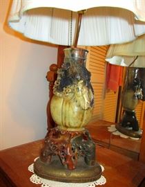 Carved Jade dragon vase converted to lamps with brass base. These were brought back from Asia. These were made in China between 1900 and 1920 and there are two of them.