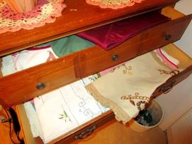 Hand embroidered table cloths by the drawerful