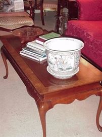 Banded mahogany coffee table; planter, etched Depression era compote, books and more