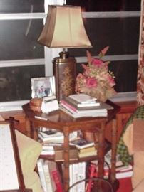 Octagonal table, books, florals, lamps