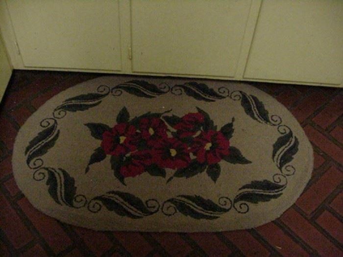 Vintage hooked rug with red floral and leaf motif