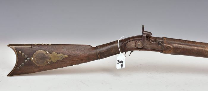 Native American owned percussion rifle with tack decoration and rawhide wraps                         bid today thru March 24th at www.fairfieldauction.com