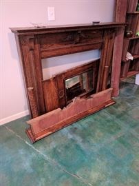 Antique fireplace mantle with mirror