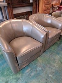 Faux leather swivel club chairs