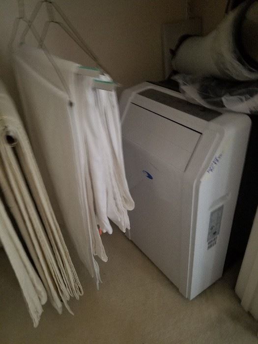 Portable air conditioner with window attachments