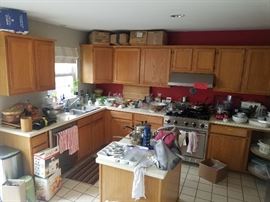 This is before we organized it- Lots of nice items including new in box ONE POT, All Clad slow cooker, large paella pan, Calphalon frying pans spices and food too.