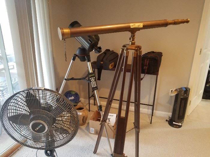 Contemporary telescope, brass telescope, metal console table, video cameras and equipment