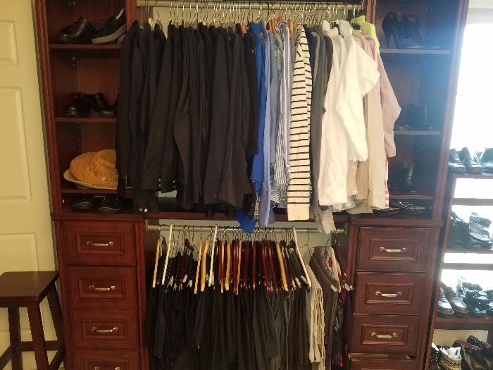 Huge walk in closet room filled with clean, contemporary, stylish better clothing and shoes