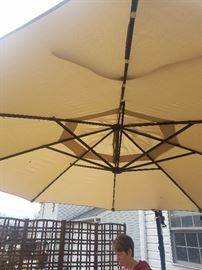 Oversized offset patio umbrella with weighted base
