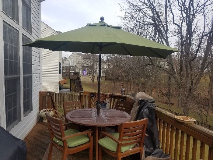 Smith & Hawken teak patio table, 4 chairs, cushions and matching umbrella